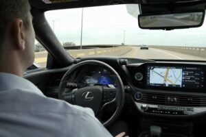Photo of man driving a car.