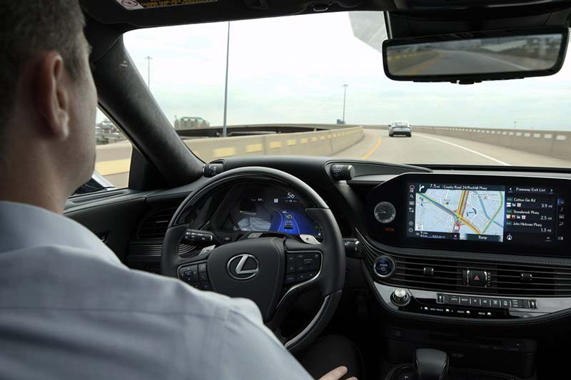 Photo of man driving a car.