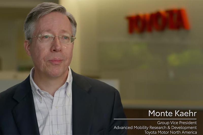 Vid cap of Monte speaking to camera.